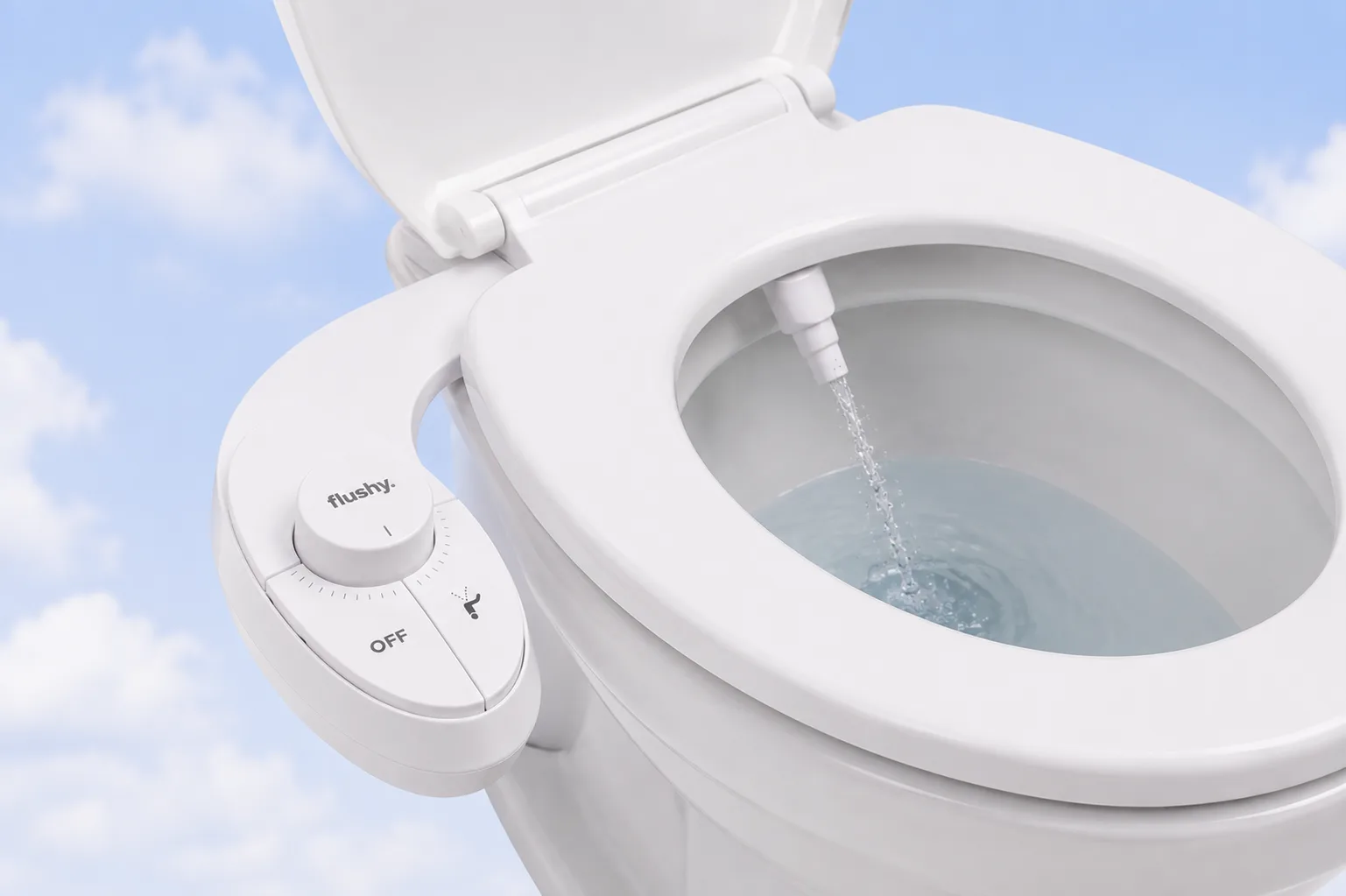 Top view of the Flushy bidet nozzle spraying fresh water into the toilet bowl